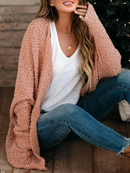 A cable knit cardigan from this range: the crossed stitches add density and hide a mark that a plain surface would show.